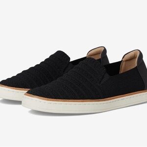 UGG women’s  black w tan rim  Slip-On shoes 9